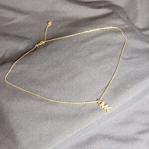 Michael Kors -“MK” logo necklace.
